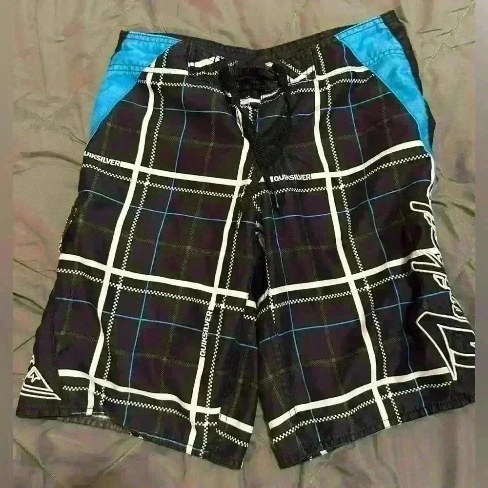 Boys Quicksilver shorts size 26 which works out to a small  black and blue